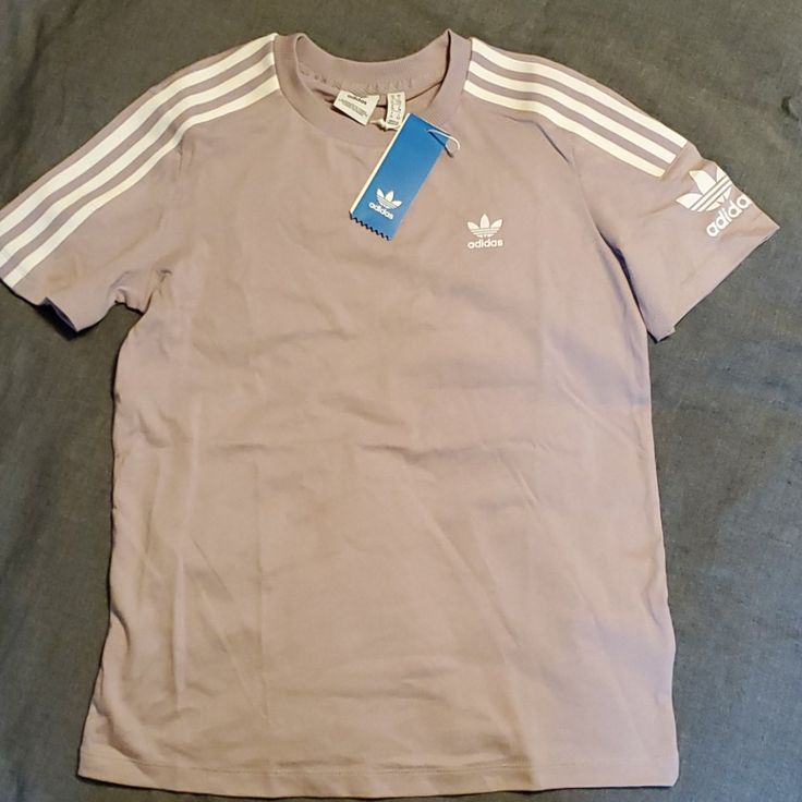 Women's Adidas Originals "Lock Up Tee". Brand New, Never Worn. Color Is A Light Lilac. Spring Adidas Three Stripes Top, Adidas Tops With Three Stripes For Spring, Adidas Short Sleeve Spring Shirt, Spring Adidas Cotton Shirt, Adidas Crew Neck Shirt For Spring, Adidas Short Sleeve Shirt For Spring, Adidas Cotton Shirt For Spring, Adidas Casual Shirt For Spring, Casual Adidas Shirt For Spring