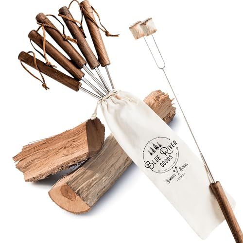 a bunch of sticks and some wood on a white surface with a bag in the middle