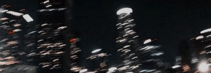 blurry photograph of city lights at night