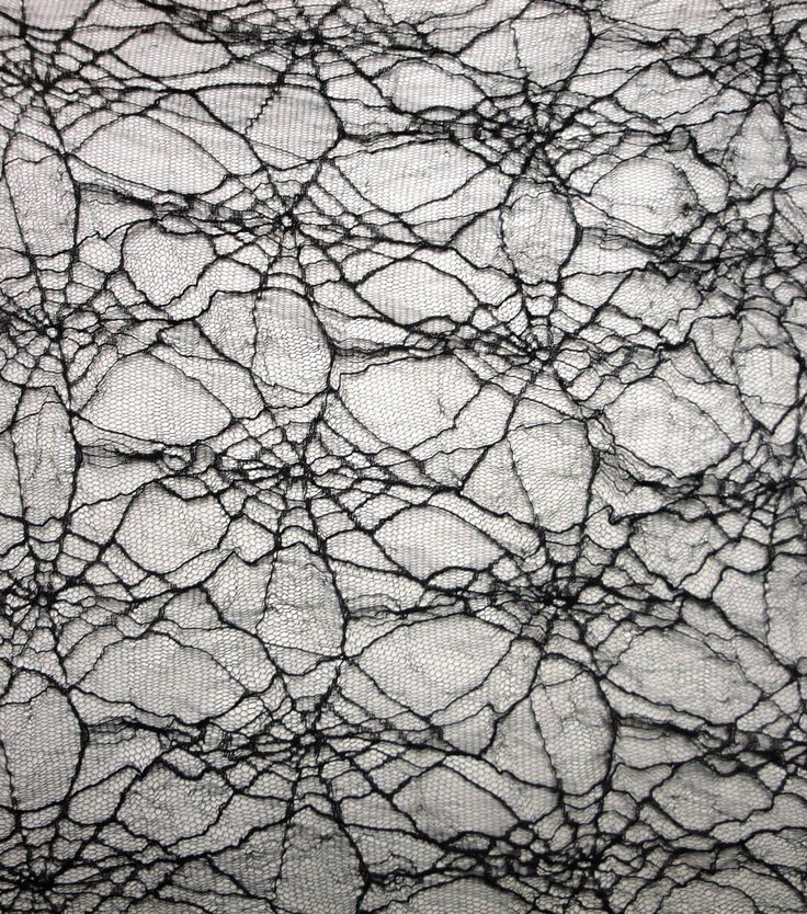 black and white photograph of an abstract pattern on fabric, with lines drawn across it