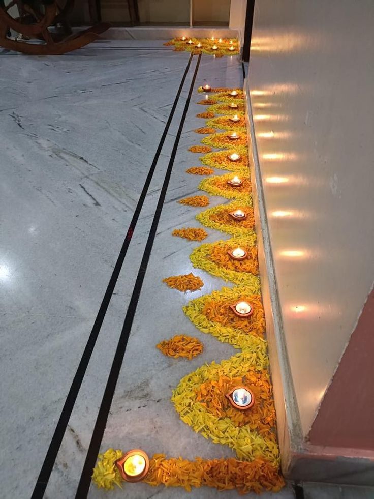 flowers and candles are laid out on the ground