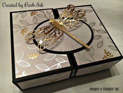 a close up of a box with a dragonfly on it