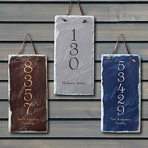 three signs hanging on the side of a wooden building that say 3500 and 6000