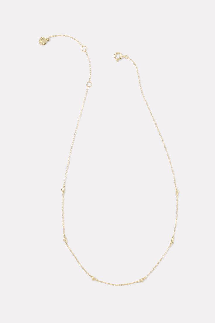 You'll fall in love with the Amour Necklace by Gorjana, featuring a delicate chain with heart accents and an 18k gold plated finish. Gold Delicate Chain Necklace With Heart Pendant, Gold-tone Necklace With Heart Pendant And Delicate Chain, Yellow Gold Heart Chain Necklace With Delicate Chain, Delicate Gold Necklace With Delicate Chain, Dainty Yellow Gold Station Necklace With Delicate Chain, Delicate Yellow Gold Heart Necklace With Delicate Chain, Everyday Heart Pendant Necklace With Gold Chain, Yellow Gold Delicate Chain Charm Necklace, Delicate Yellow Gold Station Necklace With Adjustable Chain