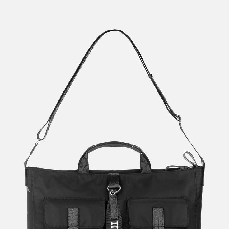 a black handbag with two compartments on the front and one compartment in the back