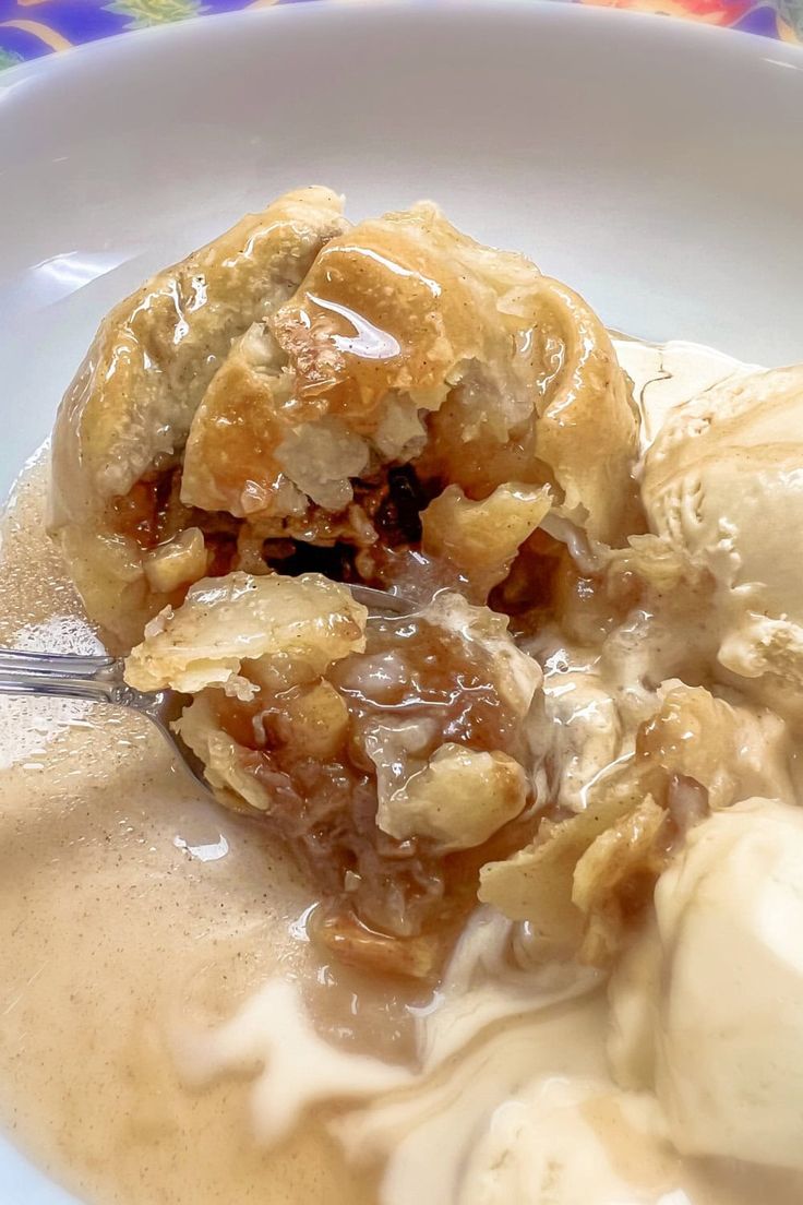 a white bowl filled with ice cream and some kind of dessert on top of it