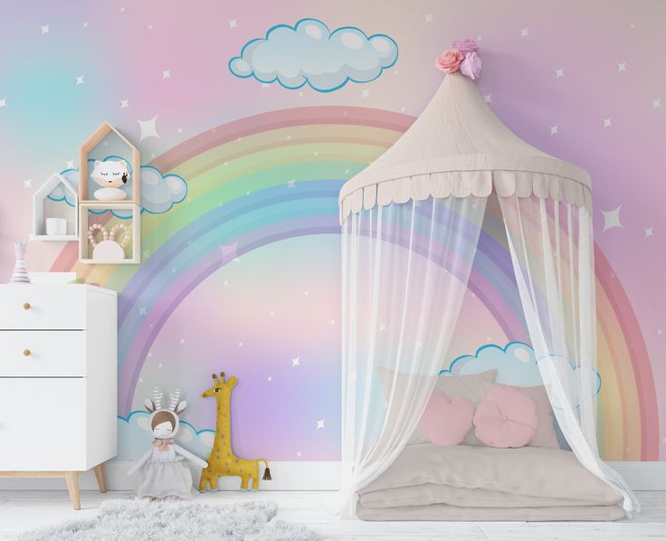 a child's bedroom decorated in pastel colors with rainbows and clouds on the wall