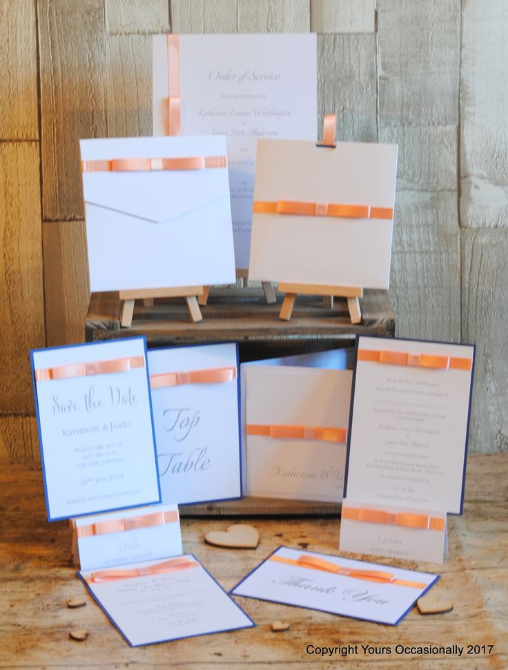 the wedding stationery is laid out on top of an old suitcase and ready for guests to arrive