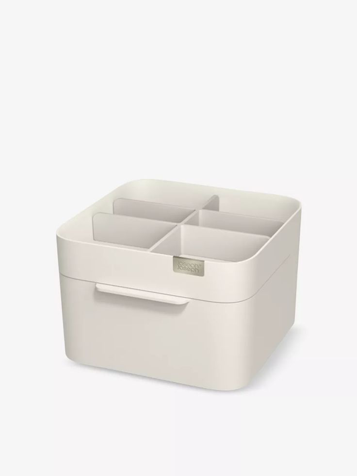 a white storage box with four compartments