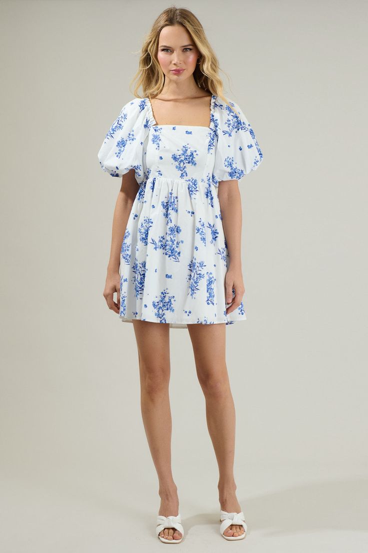 Whether you're sipping tea or rehearsing for the big day, this dress is your go-to. With oversized puff sleeves that pack a punch, they frame a square neckline and a fitted bodice with princess seams. Just below, a flared mini skirt creates a balanced feel, while the back features smocking with a large tie design. Take the look from casual to dressy and swap out the shoes. Pair it with your favorite jewelry for a completed fun look.- Oversized sleeves- Smocked back- Tie back detail- Poplin- Colo Square Neck Mini Dress With Gathered Sleeves For Brunch, Blue Puff Sleeve Dress With Lantern Sleeves For Spring, Blue Lantern Sleeve Puff Dress For Spring, Blue Lantern Sleeve Mini Dress For Brunch, Billowy Puff Sleeve Dress With Square Neck, Billowy Mini Length Puff Sleeve Dress For Brunch, Square Neck Smocked Bodice Mini Dress For Garden Party, Blue Balloon Sleeve Mini Dress For Summer, Square Neck Mini Dress With Gathered Sleeves For Daywear