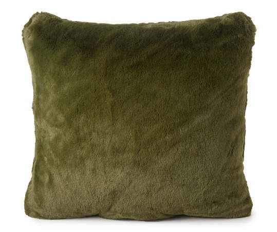 a green pillow on a white background