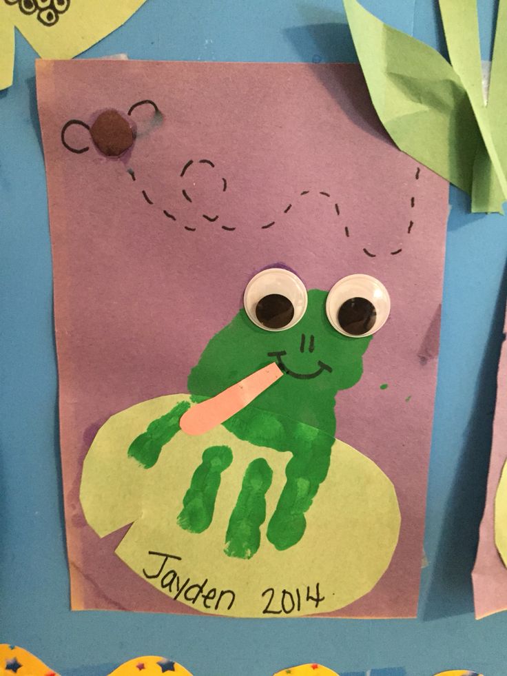 a child's paper cut out of a frog