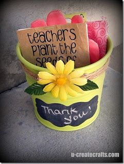 a teacher's plant pot with flowers and notes on it