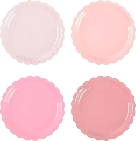 four pastel pink plates with scalloped edges on a white background, each in different colors