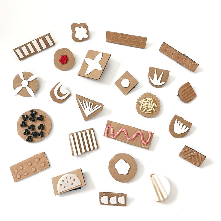 some different shapes and sizes of wooden stamps on a white background with the words diy stamps