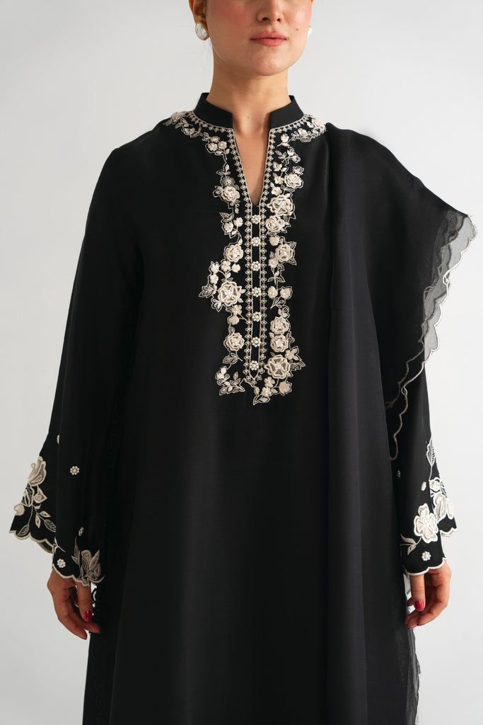 Neerja Black Unstitched Suit With Sheer Dupatta For Eid, Elegant Black Georgette Sharara, Black Silk Sets For Eid, Elegant Black Sharara With Sheer Dupatta, Black Raw Silk Unstitched Suit For Eid, Black Palazzo Set With Sheer Dupatta For Eid, Traditional Black Organza Sharara, Black Organza Sharara With Dupatta, Elegant Black Palazzo Set For Festive Occasions