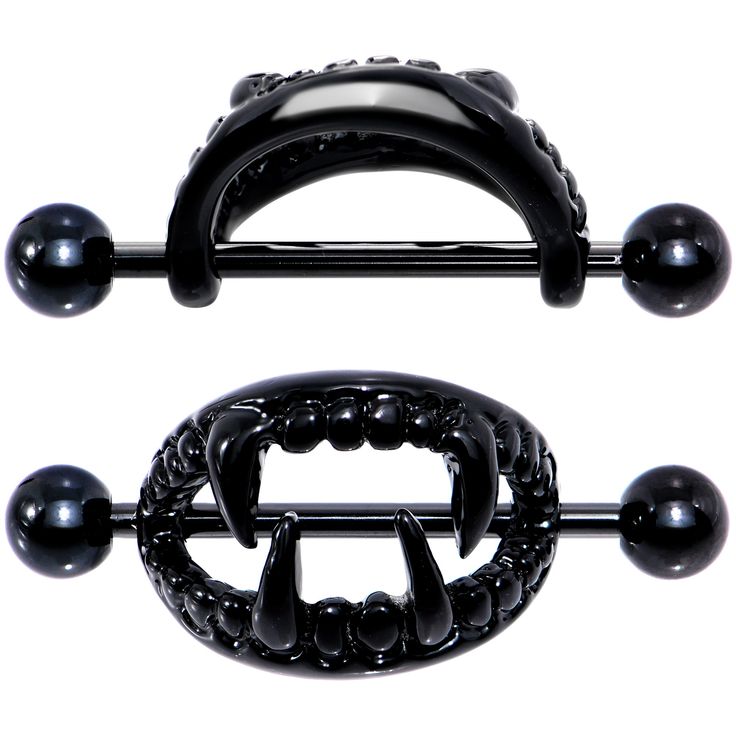 a pair of black metal balls on a white background