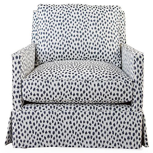 a black and white chair with polka dots on it