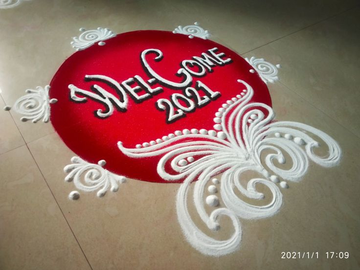 a welcome sign on the floor with white swirls