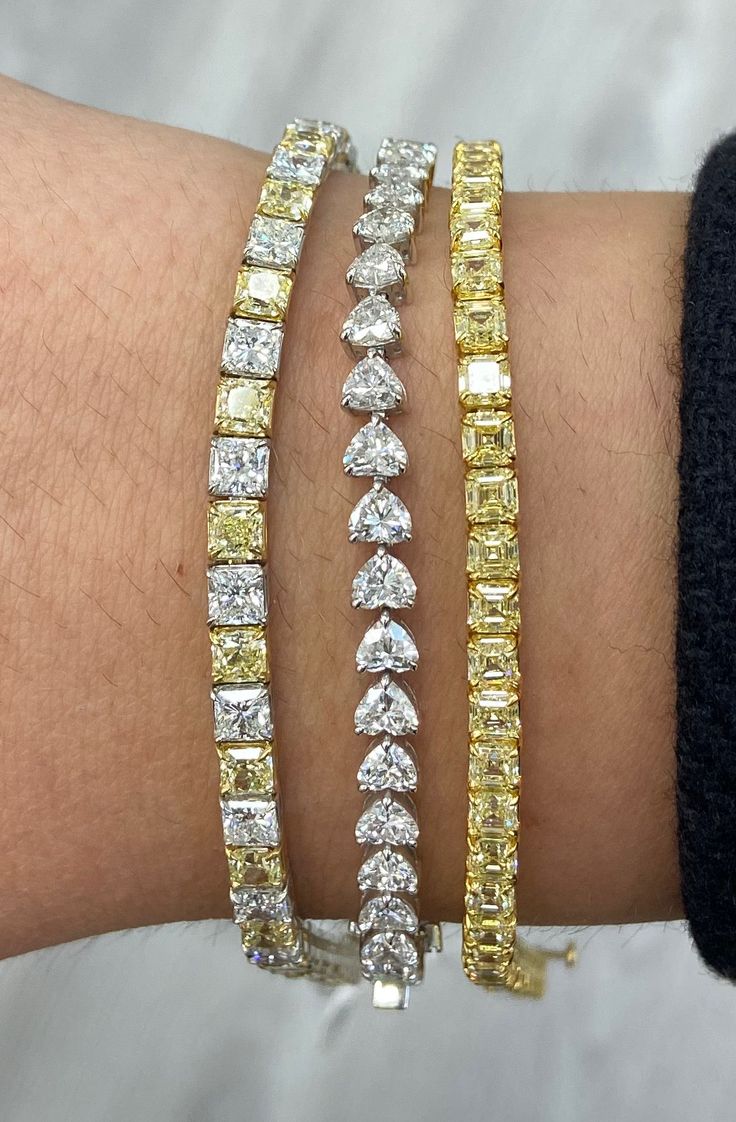 An alternating yellow and white diamond tennis bracelet is a timeless and elegant piece of jewelry that provides a twist to the classic tennis bracelet. The yellow and white diamonds create a striking contrast against each other, making the colors truly pop. The diamonds are expertly cut and handset to create a sparkling and dazzling effect on the wrist. It's a perfect gift for someone special or a treat for yourself that will be cherished for years to come. Bracelet Details: 14.94 Carat Fancy I Yellow Diamond Bracelet, Yellow Bracelet, Jewelry Staples, Accesories Jewelry, Fancy Yellow Diamond, Yellow Jewelry, Classy Jewelry, Fancy Diamonds, Stacked Jewelry