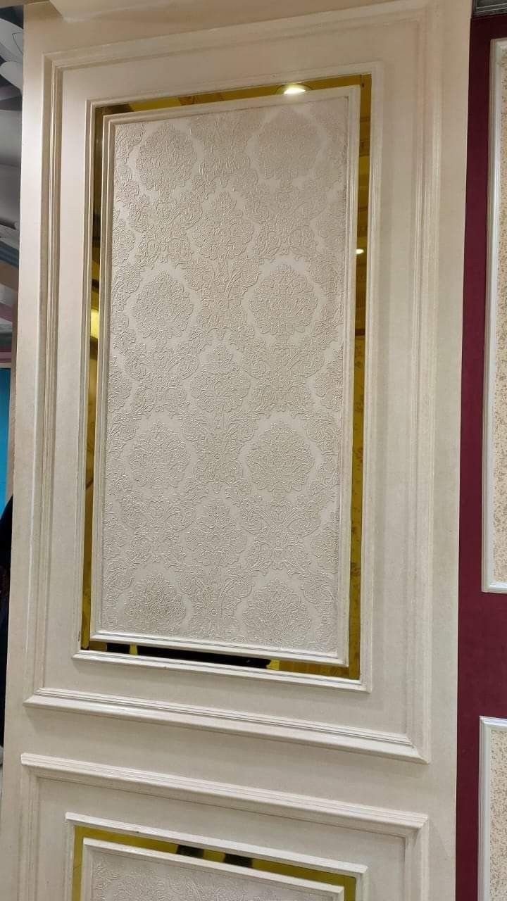 a white wall with gold trim around it