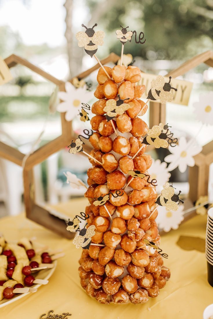 a table topped with lots of donuts covered in toppings