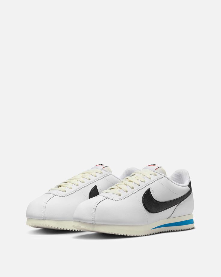 Men's Nike Cortez in White and Photo Blue. The Bill Bowerman designed sneaker features a white smooth leather upper with a black tumbled leather swoosh and heel. Photo Blue accents sit on top of the sail midsole. Nike Cortez White, Bill Bowerman, Low Top Nikes, Aesthetic Nike, Sport Aesthetic, Nike Sale, Sports Aesthetic, Elevated Basics, Blue Nike