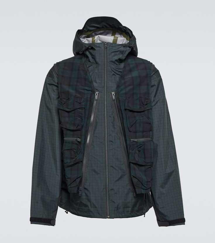 Undercover revisits its versatile layered style with this blouson jacket. Made from lightweight nylon, this hooded jacket has contrasting checked prints and a detachable utility vest concealing two expansive zippered pockets. | Undercover Checked layered blouson jacket Utility Vest Outfit, Layered Style, Blouson Jacket, Utility Vest, Vest Outfits, Curator Style, Hooded Jacket, Mens Outfits, Green