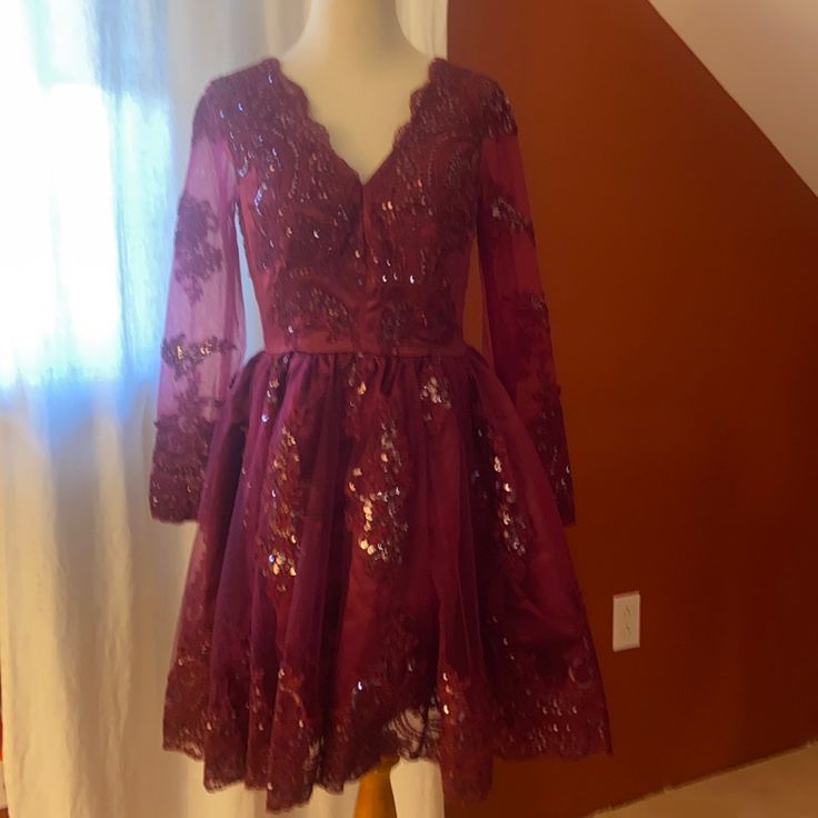 Great For The Holidays!This Burgundy Sequin Dress Is Great For A Holiday Party. Or A Winter Wedding New With Tags Size 8. I Think It Runs Small Though. Measures From Shoulder To Hem Approximately 34” Long Sleeve Sequin Dress For Homecoming Party, Holiday Lace Party Dress, Holiday Party Lace Dress, Elegant Pink Fitted Holiday Dress, Long Sleeve Homecoming Dresses For Party Season, Lace Homecoming Dress With Sequins, Fall Party Dress With Sweetheart Neckline, Pink Fitted Holiday Dress For Wedding, Fitted Pink Holiday Dress For Wedding