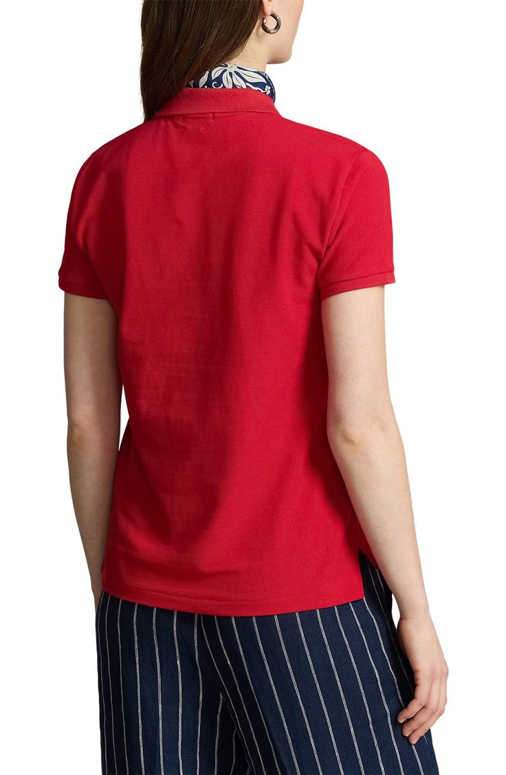 First introduced in 1972, the brand's iconic cotton shirt features a straight silhouette and a gently relaxed fit. Two-button closure Polo collar Short sleeves 100% cotton Dry clean or machine wash, tumble dry Imported Casual Red Polo Shirt With Collared Neckline, Cotton Shirt With Collared Neckline In Solid Color, Solid Cotton Shirt With Collared Neckline, Classic Red Tops With Collared Neckline, Casual Red Top With Collared Neckline, Red Casual Top With Collared Neckline, Cotton Tops With Collared Neckline And Placket, Cotton Top With Collared Neckline And Placket, Red Collared Polo Shirt With Button Closure