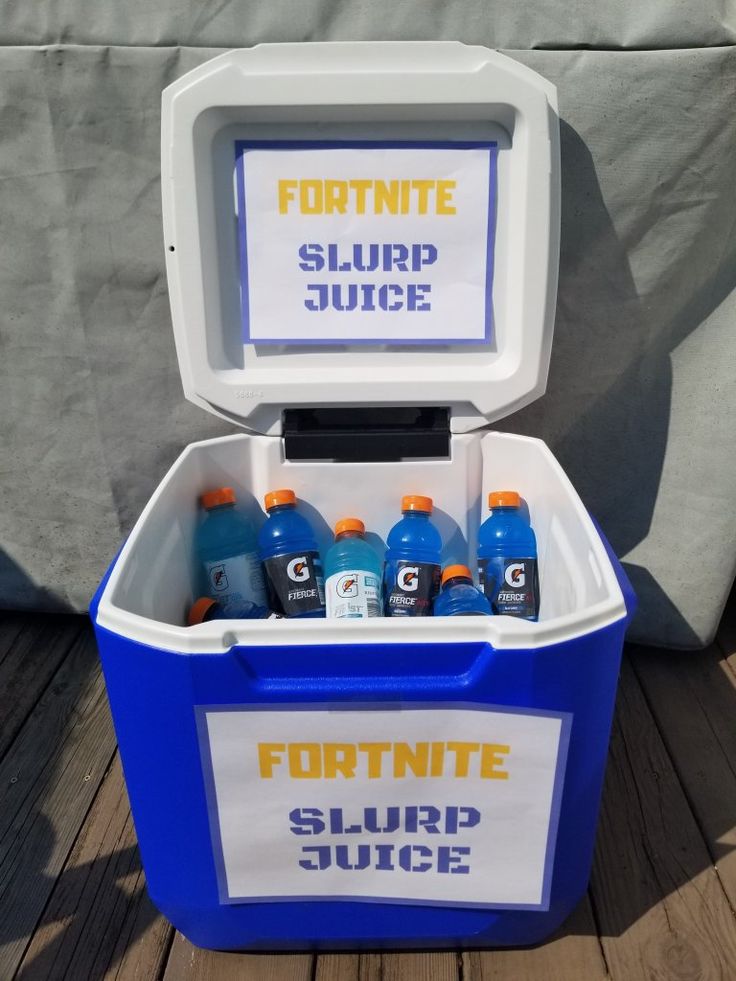 a cooler with six bottles of liquid in it