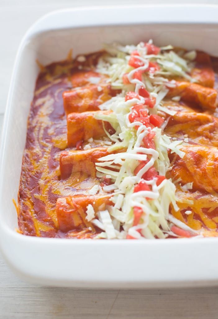 a casserole dish with meat, cheese and sauce