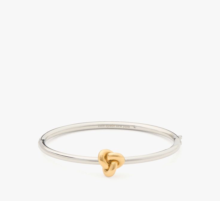 Tie your look together with this polished silver-tone bangle. | Kate Spade Double Knot Hinged Bangle, Silver Gold Silver Kate Spade Bangle Bracelet, Kate Spade Bangle Bracelet For Formal Occasions, Kate Spade Formal Bangle Bracelets, Kate Spade Formal Bangle Bracelet, Kate Spade Silver Jewelry For Formal Occasions, Kate Spade Silver Formal Jewelry, Bangle Silver, Double Knot, Gold Gift