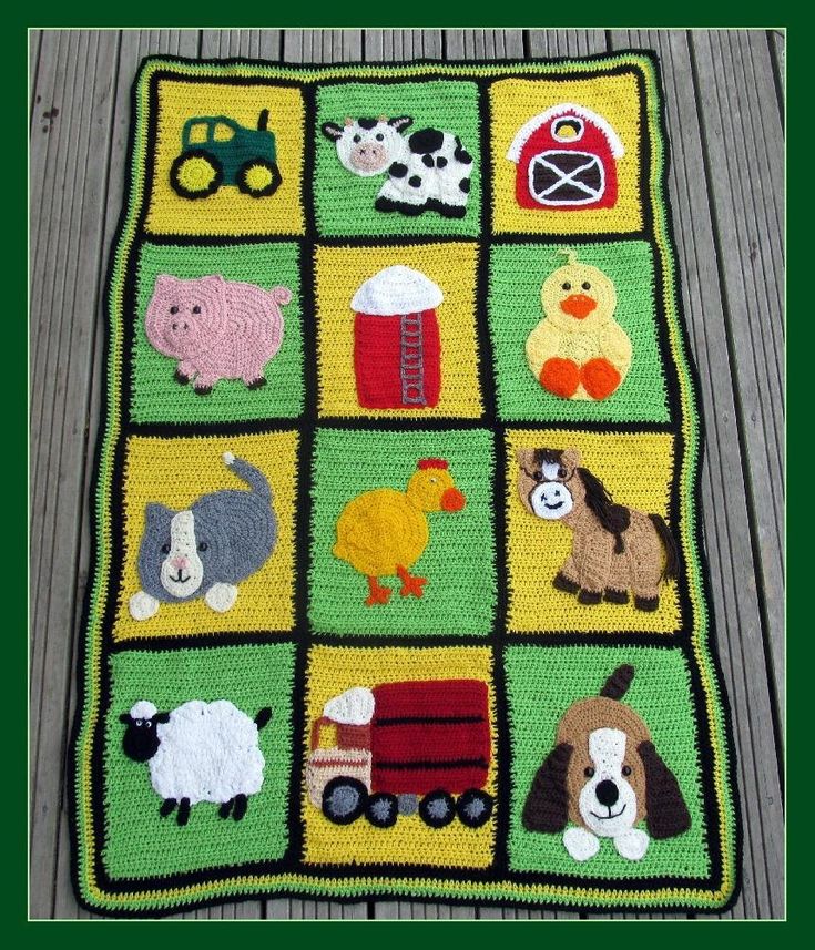 a quilted blanket with farm animals on it