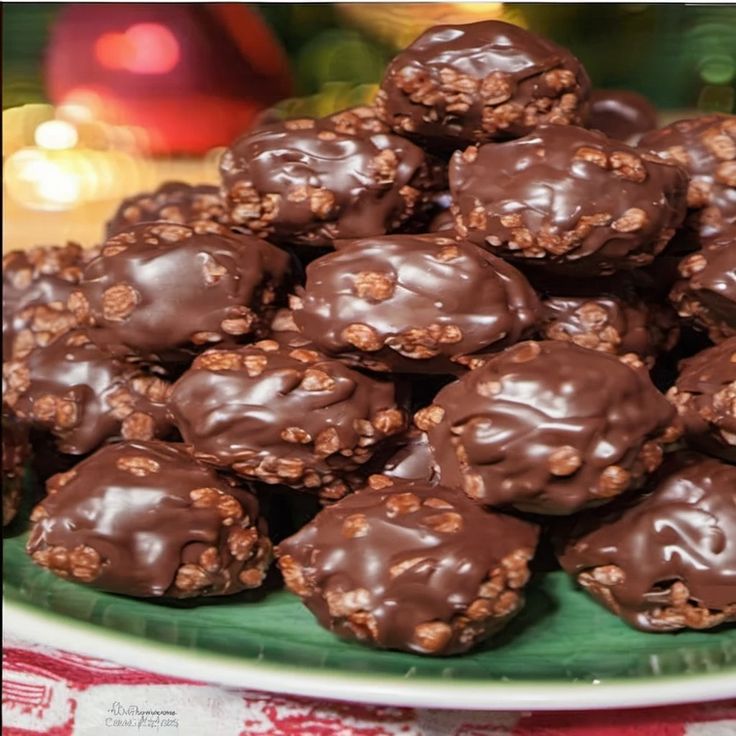 a plate full of chocolate covered cookies on a table