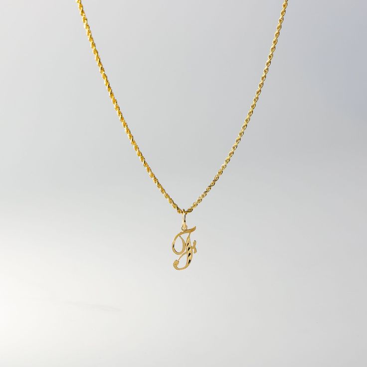 A timeless piece that will never go out of style. This 14K gold calligraphy pendant is the perfect and most stunning way of keeping a name close to your heart. We handmade each piece so you can assure you're getting a one-of-a-kind pendant that is not like any other. This 14K solid gold letter pendant is flawlessly crafted to look super chic and elegant around your neck. Pair it with a nice gold chain and wear it with almost all of your outfits. The piece is such a versatile lettering necklace. Yellow Gold Pendant Charm Necklaces With Monogram, Yellow Gold Monogram Pendant Charm Necklaces, Gold Initials Pendant Necklace, Yellow Gold Monogram Pendant Charm Necklace, Gold Custom Initial Pendant Necklace, Gold Custom Initial Pendant Necklace Hallmarked, Custom Gold Initial Pendant Necklace, F Necklace, F Initial