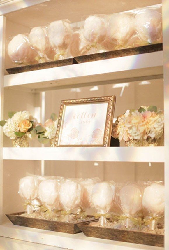 the shelves are filled with flowers and framed pictures