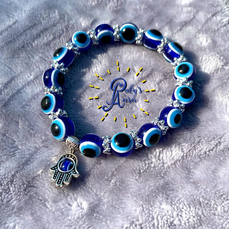 Adjustable Blue Crystal Bracelet For Meditation, Blue Hand-strung Bracelets For Festival, Adjustable Turquoise Beaded Bracelets With Evil Eye, Evil Eye Bead Bracelet Gift, Hand-strung Blue Spiritual Bracelets, Blue Hand-strung Spiritual Bracelets, Blue Spiritual Hand-strung Bracelets, Spiritual Blue Hand-strung Bracelets, Adjustable Blue Hand-strung Rosary Bracelet