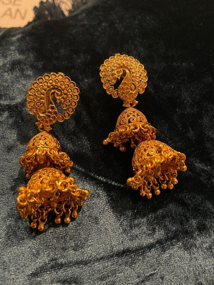 "One of a kind gold peacock jumkhas. 2\" long. Lightweight earrings great for the festive season."