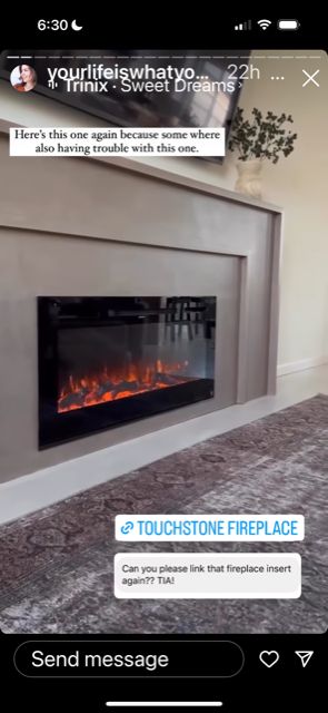 a fire place in the middle of a living room with someone's text message