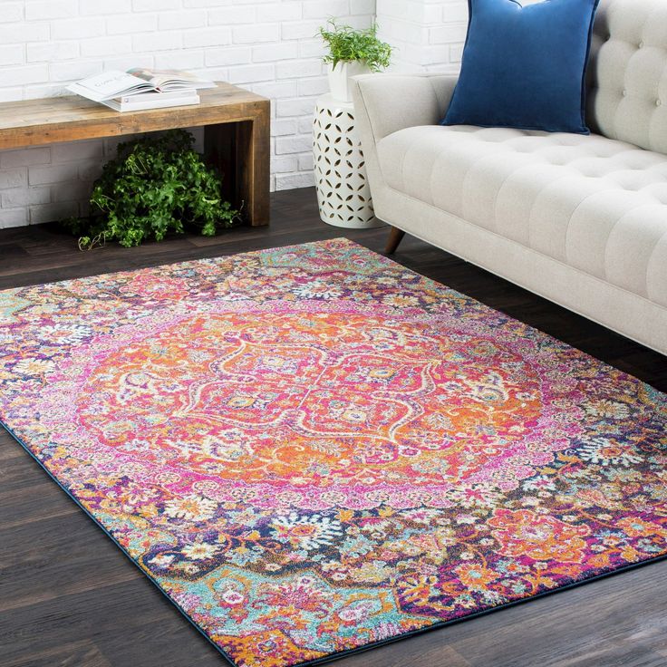 a colorful area rug in a living room