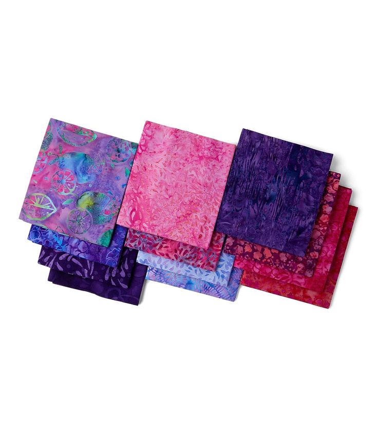 six pieces of purple and pink fabric on a white surface with one piece folded over the other