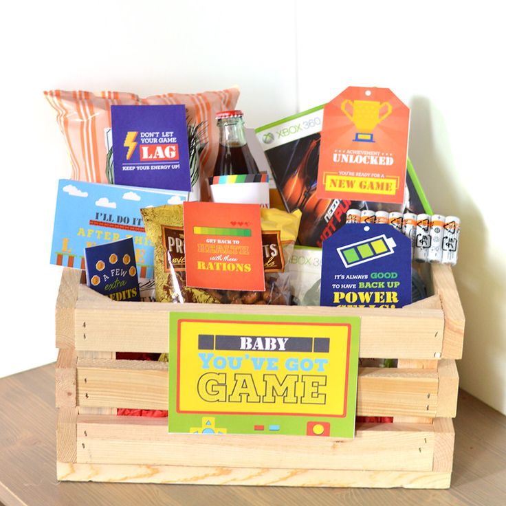 a wooden crate filled with lots of different types of food and snacks on top of a table