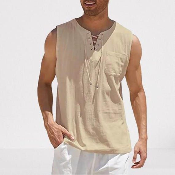 Description: Introducing a versatile and stylish addition to your wardrobe: the Men's Casual Cotton Linen Sleeveless Vest. This vest is crafted from a premium cotton-linen blend, providing comfort and breathability for year-round wear. The bandage lace-up design adds a modern, trendy touch, making it suitable for various occasions. Layer it over your favorite shirt or wear it alone to create a chic and fashionable look that's perfect for any season. Linen Set Outfit, Men Linen Shirt, Lace Up Tank Top, Sleeve Placket, Hippie Tops, Linen Tank Top, Linen Tank, Linen Tshirts, Style Basic