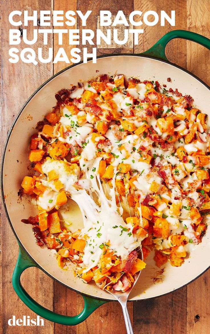 a green skillet filled with cheesy bacon and butternut squash