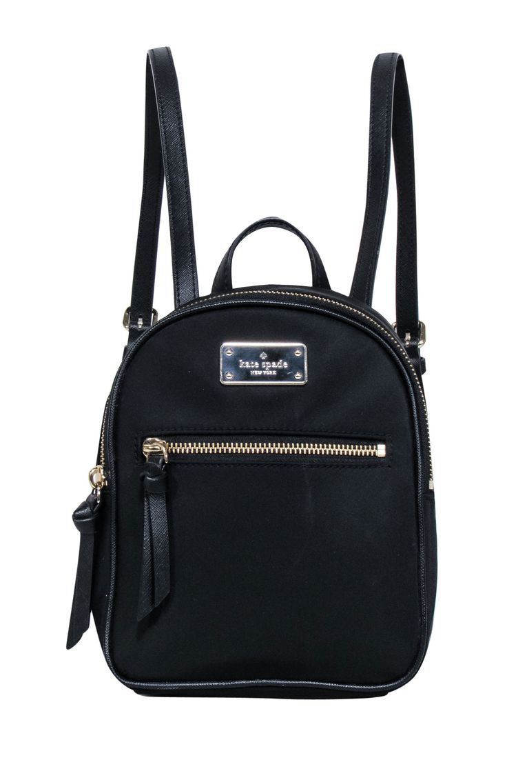 Be ready for any adventure with the Kate Spade black nylon mini backpack. Perfect for a weekend getaway, this backpack stores all your essentials in style. From hiking to picnics, it's a must-have for any fun-filled excursion. 100% Nylon Fabric lining Logo plaque front Top zipper closure Front exterior zipper pocket Adjustable straps Height 8.25" Width 6.5" Depth 3.5" Backpack Store, Kate Spade Backpack, Classic Wardrobe Staples, Kate Spade Accessories, Kate Spade Purse, Nylon Fabric, Weekend Getaway, Black Nylon, Mini Backpack