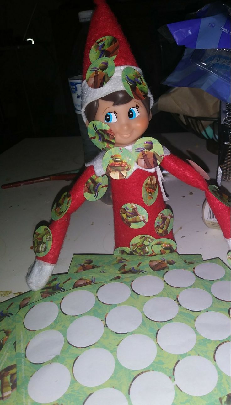 an elf doll sitting on top of a table