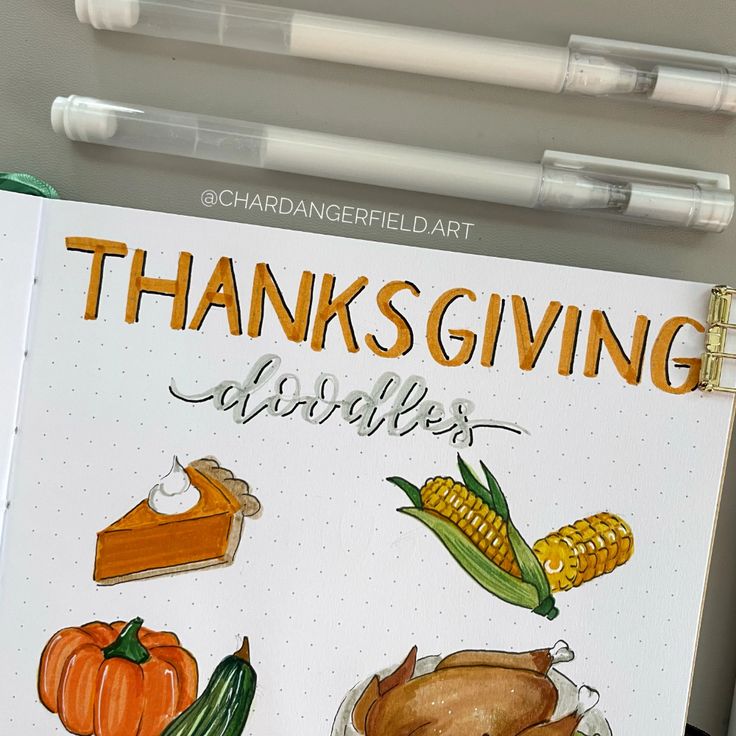 an open notebook with thanksgiving images on it