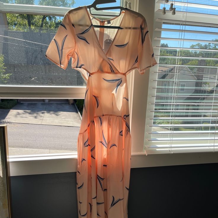 Peach Maxi Dress With Blue Leaves Side Cut Outs Criss Cross Top Zipper Down The Back Extremely Sheer & Not Linedwould Be Good For A Cover Up Size Small Casual Peach Midi Dress With Short Sleeves, Peach Maxi Dress For Summer Day Out, Pink Breezy V-neck Maxi Dress, Pink V-neck Breezy Maxi Dress, Peach Short Sleeve Midi Dress For Spring, Peach Midi Dress With Short Sleeves For Spring, Peach Floral Print V-neck Midi Dress, Peach Short Sleeve Midi Dress For Summer, Casual Peach Midi Dress For Brunch