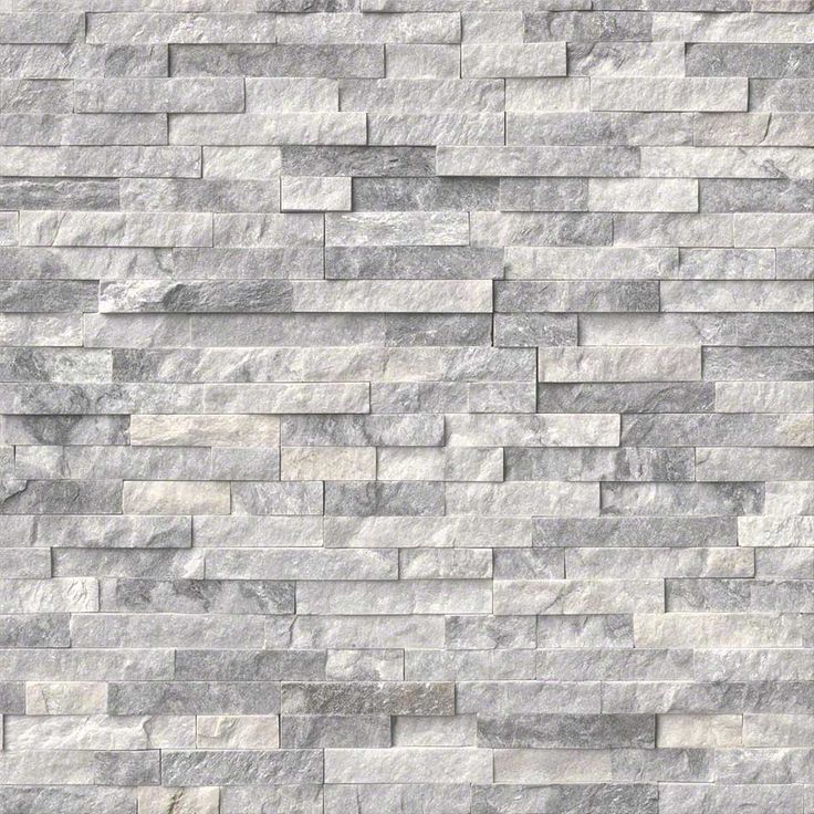 a white brick wall that is made out of grey marble bricks and has no mortars or mortars on it